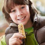 Child Snacking on Cereal Bar