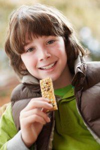 Child Snacking on Cereal Bar