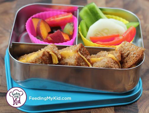 Back to School Lunch Ideas- Grilled Cheese and Veggie Dippers. A great way to make a basic grilled cheese sandwich more fun! Paired with a side of veggies this is a fully dippable lunch! 