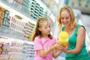Grocery Shopping with Kids Looking at Food Labels