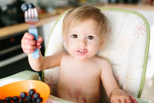 Child Eating Blueberries