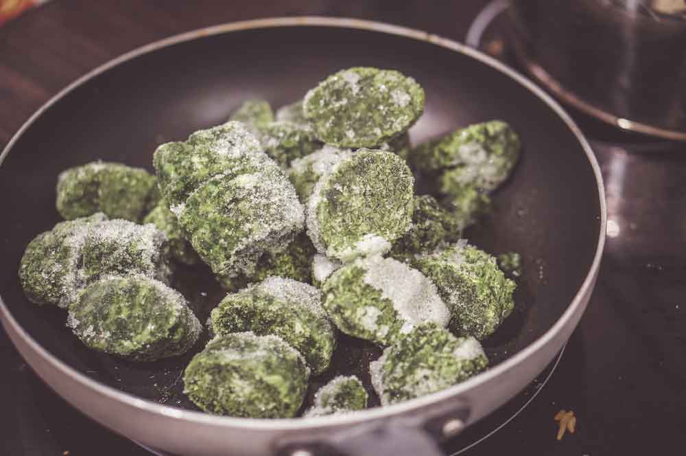 Reheat your frozen spinach balls on the stovetop.