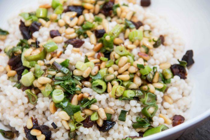 This Israeli couscous salad has the mild flavor of scallions and the nuttiness if the pine nuts. Try this super simple side dish any night of the week.