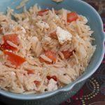 This easy orzo salad combines salty feta cheese with fresh cherry tomatoes. Super easy and goes great with a ton of meals!
